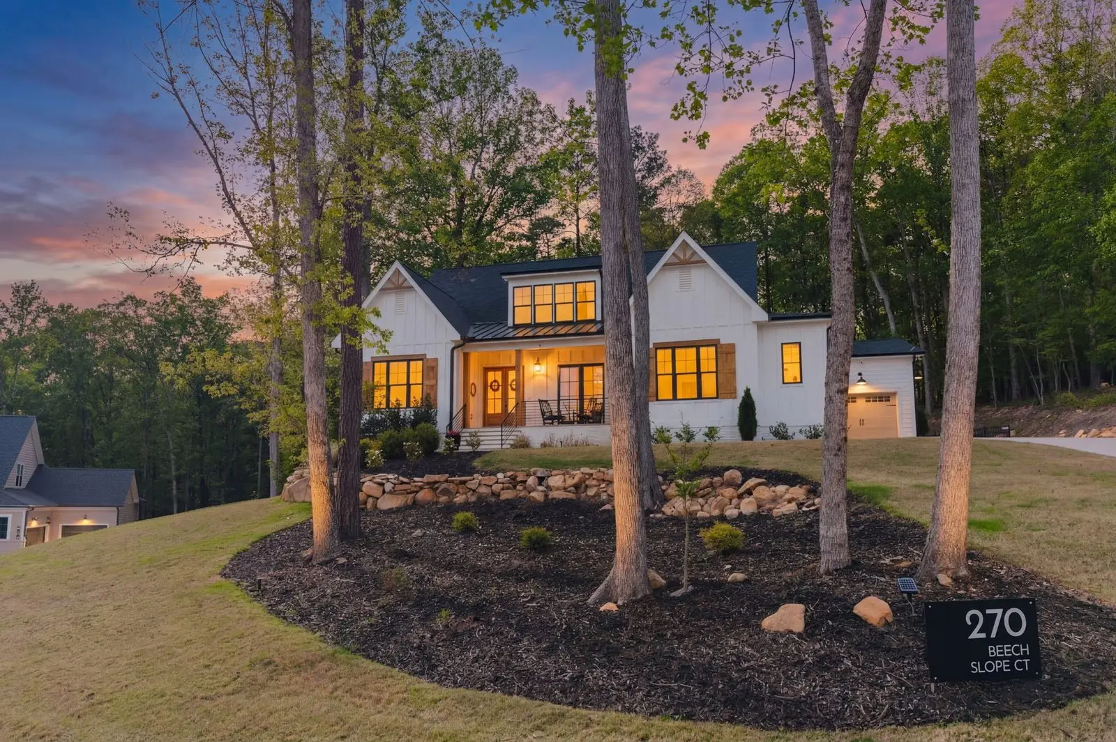 Aerial of 270 W Beech Slope Ct showing modern farmhouse facade and 1-acre Westfall lot