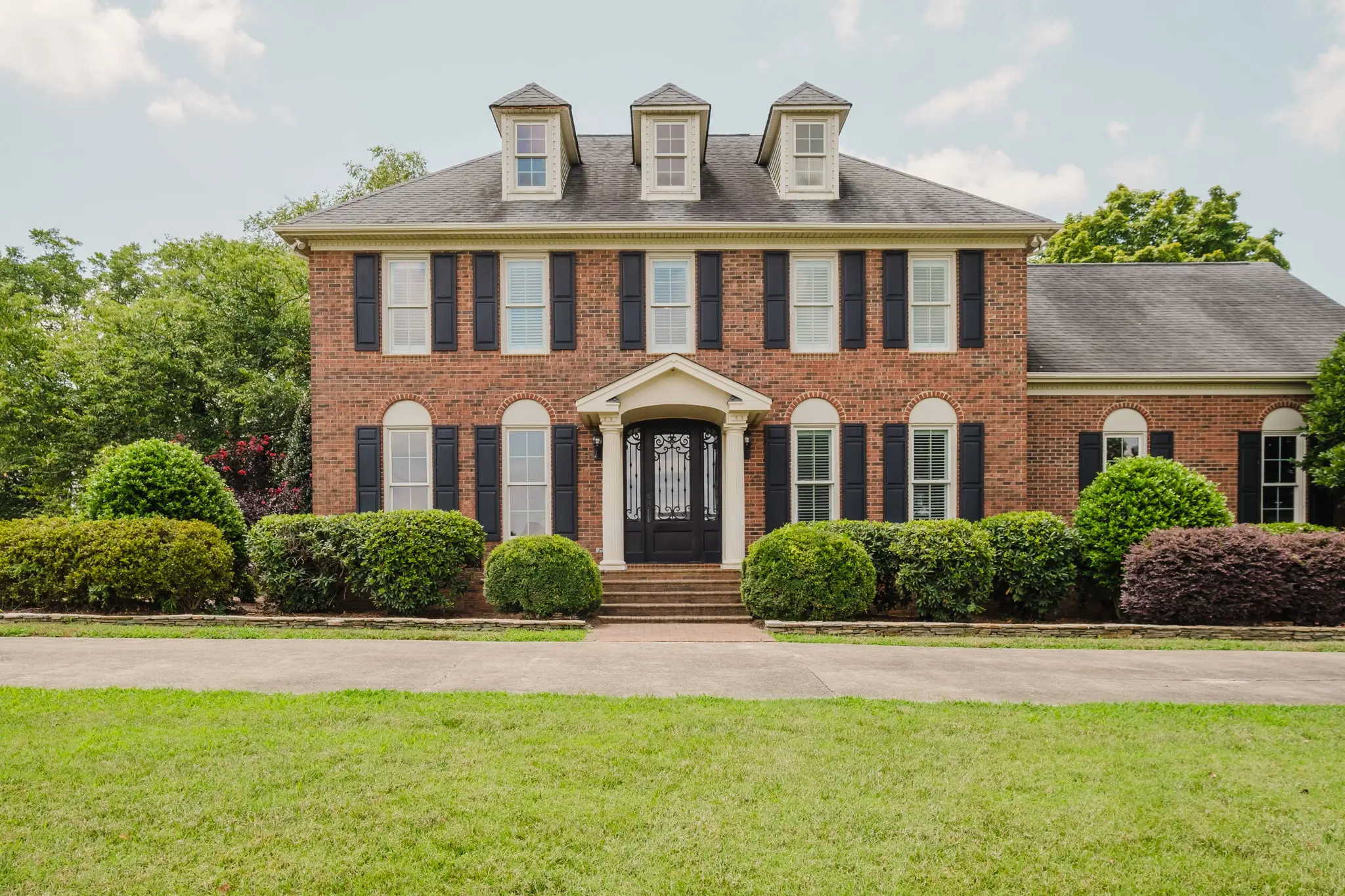 Charlotte brick traditional listing exterior, the typical $500K-$900K Charlotte home where Standard package pricing applies