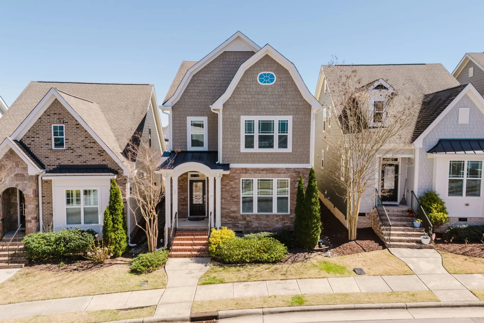 Modern Charlotte townhome exterior, the kind of inventory where buyers expect an interactive tour bundled into the listing