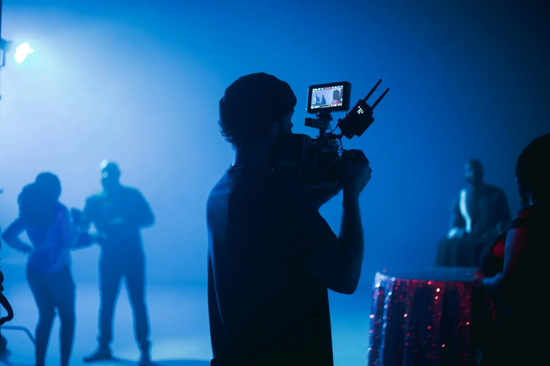 Agency creative director and OSDT pilot reviewing a live FPV feed on an iPad during a Charlotte production shoot
