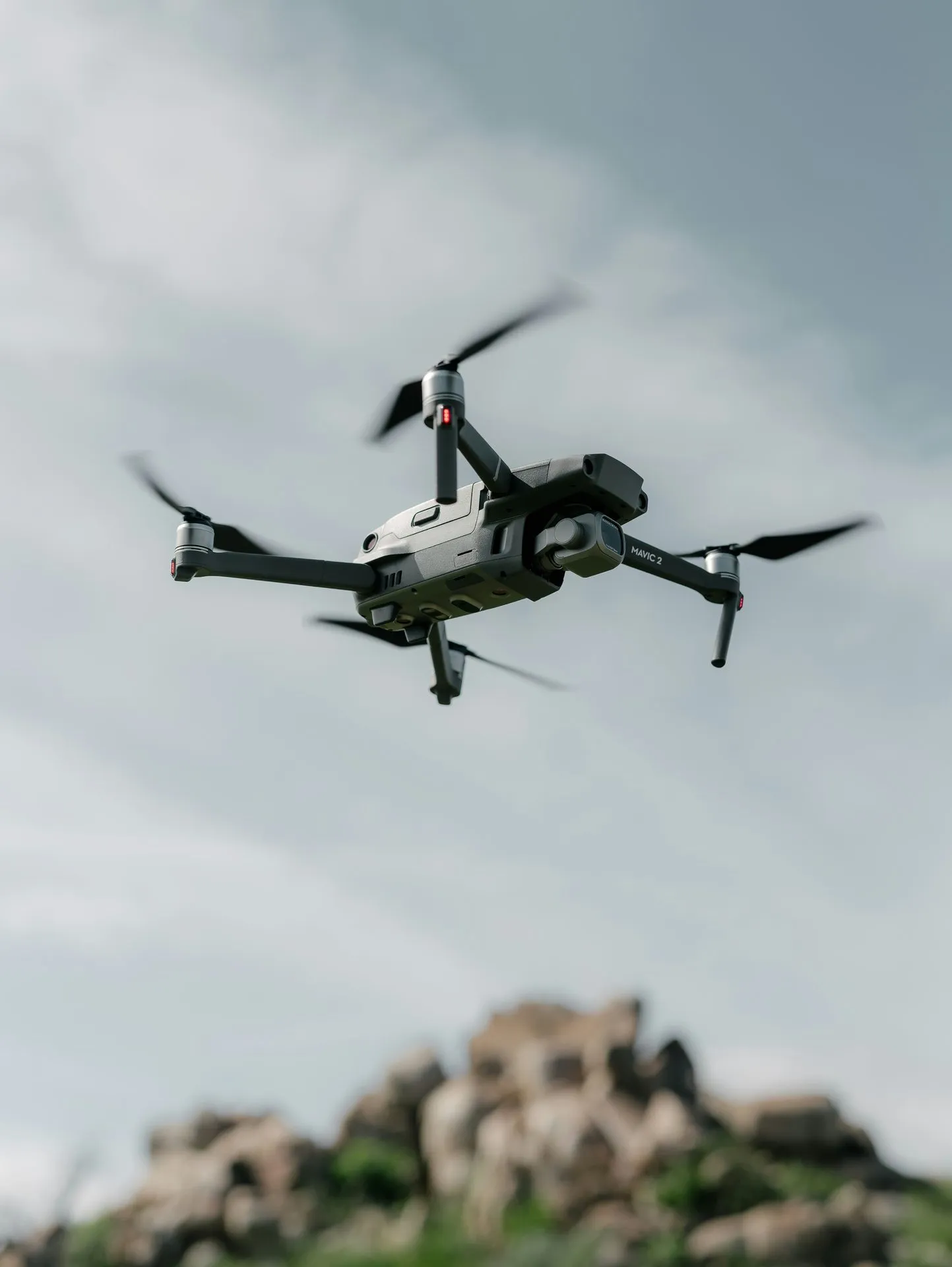 Camera drone in flight over a site, the aircraft class used for grid and orbit documentation capture